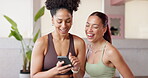 Fitness, women and friends laughing with phone in yoga studio for funny post, show meme or resting. Pilates break, people and happy with smartphone at health club for comic exercise video and gossip
