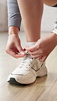 Fitness, hands and woman tie shoes at health club to start workout, exercise preparation or routine. Wellness, person and shoelace in studio for training comfort, physical activity and getting ready