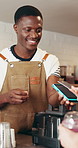 Customer, barista or POS machine with credit card in cafe for tap payment, smoothie purchase or sale. People, cashier and happy with transaction at counter for drink order, easy checkout and fintech
