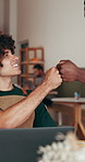 Fist bump, laptop and team in coffee shop for small business, website launch and positive service review. Hospitality, men or tech in startup cafe for online menu update, colleague support or gesture
