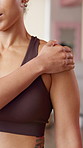 Shoulder pain, hands and woman in studio for yoga, wellness and exercise with muscle strain. Health club, massage and person with tension, joint ache and inflammation for pilates workout accident
