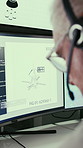 Computer screen, headset and satellite with man in office to monitor equipment for maintenance. Display, security and technology with mature person at desk in workplace for communication or safety