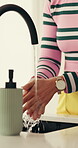 Tap, washing hands and water with woman in kitchen of home to remove bacteria or germs for hygiene. Cleaning, faucet and sink with person closeup in apartment for disinfection or sanitization