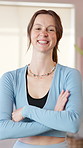 Smile, arms crossed and face of woman for fitness, exercise and training in health club. Gym studio, portrait and female person with wellness, confidence and support for personal trainer and growth