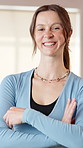 Gym, arms crossed and face of woman for fitness, exercise and training in health club. Smile, portrait and female person with wellness, confidence and support for personal trainer studio and growth