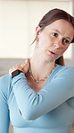 Studio, neck pain and woman in gym for yoga, pilates class and exercise for wellness, health and massage. Accident, active and person with muscle strain, tension and sprain for workout injury
