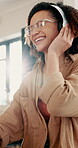 Student, dancing and woman listening with headphones in home to relax, streaming music and radio. Flare, study break or happy person resting with audio tech, playlist or track sound for entertainment