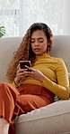 Phone, typing and woman relax on sofa for online communication, chat and texting with app. Mobile, post and person in home, reading message and notification on social media website in living room