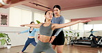 Fitness, yoga and women in studio with class, mobility or guidance in body practice. Pilates, warrior pose and instructor in gym with support, posture or balance improvement in wellness club.