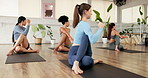 Yoga, studio and women in class for exercise, wellness and practice for flexibility. Pilates, fitness club and people with instructor in lesson for balance, health and posture on mat for active hobby
