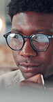 Editing, article and man with glasses, office and creative with research, journalist and reflection. Proofreading, story and black person with eyewear for project, thinking or review info in newsroom