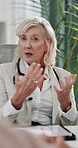 Mature woman, doctor and meeting with team talk, planning and healthcare services in office at clinic. Person, leader and hospital director with agenda, tablet or info for medical staff in boardroom