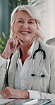 Medical, face and mature woman in hospital with smile, confidence or career pride in healthcare. About us, happy or doctor in clinic with stethoscope, general practitioner or experience in wellness.