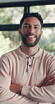 Arms crossed, smile and face of man in home for confidence, real estate investment and relax. Happiness, weekend break and homeowner pride with portrait of person in living room of apartment for rest