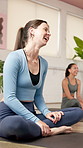 Yoga, meditation and woman with fitness, funny and smile with holistic healing, awareness and balance. Group, happiness and people in health club, laugh or pilates with humor, stress relief and calm