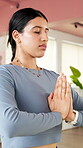 Yoga, mindfulness and woman in studio with prayer hands for meditation, holistic wellness and fitness. Zen, calm and female person in health club with mudra for balance, peace and chakra healing.