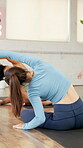 Instructor, woman and yoga stretching in class with guidance, balance support and self care. People, coaching and helping with spinal posture, yogi technique and holistic healing for wellness session