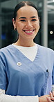 Asian woman, face and happy nurse in hospital for healthcare, wellness and tablet at night. Portrait, smile and medical professional in clinic, surgeon or physician with technology in South Korea