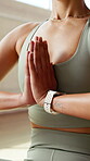 Woman, yoga or peace in studio with prayer hands for meditation, holistic wellness or chakra healing. Female person, calm or zen workout in health club with mudra for balance, mindfulness or fitness.