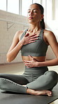 Yoga, breathing and woman with fitness, heart health and balance with wellness, meditation and chakra. Calm, mindfulness or person in studio, holistic healing and pilates with exercise, relax and zen