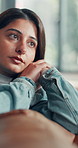 Depression, memory and mistake with woman on sofa in living room of home for regret or stress. Disappointment, loss and thinking with unhappy person in apartment for contemplation, fail or reflection