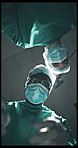 Face, surgery team and doctors with POV for medical help, flare or emergency treatment with tools. Operation, surgeon and healthcare procedure below, life saving or people with mask in clinic theater