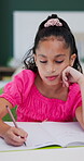Development, learning and writing with girl student in home study for education or growth. Academics, homework and notebook with child pupil at desk in apartment for knowledge or school assessment