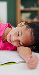 Girl, child and sleep with homework, book and tired with learning disability for task at house. Kid, exhausted and notebook for education, fatigue or burnout for assignment with rest in apartment
