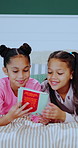 Children, sisters and reading book in bed, happy and pyjamas for storytelling, bonding and learning. Girl, kids and smile with literature, fairytale or excited with love at bedtime in family home
