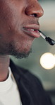 Headset, talking and mouth of black man in office with customer service, crm or communication. Contact us, mic and African male technical support consultant for online query with client in workplace.