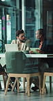Collaboration, laptop and tablet with business people in boardroom together for development. App, computer and conversation with employee team in glass office for planning or project management