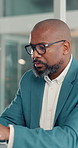 Business, glasses or black man in office, tech or financial agency with clear vision. Mature person, investor or employee in workplace, eyewear or blue light exposure with report for revenue or email