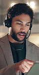 Man, headset and tablet at night in call centre for consulting, customer support and online inquiry. Male agent, talking and digital for virtual assistance, contact client and deadline for crm advice