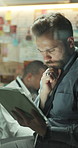 Thinking, man and detective with tablet at night for research, investigation and evidence report. Team, digital and reading for witness statement, case information and working late for murder suspect