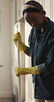 Spring cleaning, sweeping or black woman in home with broom, dirt prevention or removal in domestic chores. Hygiene, housework or girl in kitchen with gloves, sanitation or maintenance for floor care