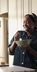 Dance, sing and breakfast with black woman in kitchen for nutrition, energy and music. Streaming, happiness and morning meal with female person eating in home for healthy food, vitamins and snack