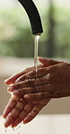 Tap, washing hands and water with person in kitchen of home to remove bacteria for hygiene. Cleaning, germs and liquid with faucet in apartment for disinfection, protection or sanitization of skin