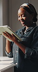 Smile, black woman and reading with tablet at house for research, social media and browsing website. Happy, female person and digital app for online morning news, download ebook and surfing internet