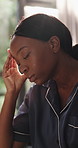 Black woman, morning and anxiety with headache in bedroom for mistake, fear or financial loss. Disappointed, panic or female person in home with stress for mental health crisis, debt or pressure