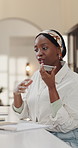Phone call, loudspeaker and black woman in office, night and deadline for submission. African person, contact or journalist with smartphone, communication or talking with recording for story idea 