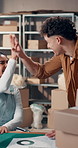 Small business, logistics and people with high five in warehouse for sales target, order or success. Teamwork, excited staff and celebration for performance metrics, distribution profit and good news