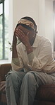 Thinking, sad and woman with depression on couch for reflection, contemplation and disappointment. Upset, shake head and black person with anxiety, mental health and thoughts in home living room.