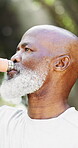 Fitness, senior man and drinking water outdoor for hydration, wellness and runner on break. African person, self care and thirsty with bottle for electrolytes, refresh and body health in retirement