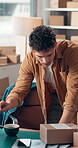Small business, man and laptop with box in warehouse for stock update, order processing or logistics. Supply chain, person and package to track shipment, distribution service and inventory management