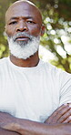Arms crossed, face and hiking with black man outdoor in nature for activity, fitness or hobby. Exercise, retirement and wellness with mature African hiker in forest for adventure, journey or travel