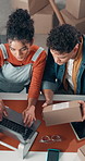 Box, laptop and typing with team in office together for delivery or parcel tracking from above. Collaboration, computer and distribution with logistics people in workplace for supply chain shipping