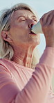 Fitness, elderly woman and drinking water outdoor for hydration, wellness and runner on break. Senior person, rest and thirsty with bottle for electrolytes, refresh and body health in retirement
