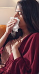 Coughing, sick and tissue with woman in bedroom of home for recovery from cold or flu virus. Allergy, breathing and lung disease with Indian person on bed in apartment for asthma or sinus symptoms