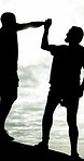 Help, high five and hiking with men silhouette by sea together for bonding, fitness or hobby. Celebration, motivation and support with excited friends on beach for adventure, journey or success
