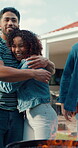 Barbecue, party and hug with man and friends outdoor for smile social reunion and celebration. Bbq flames, happy and support with people in backyard of home for welcome, holiday and cookout grill